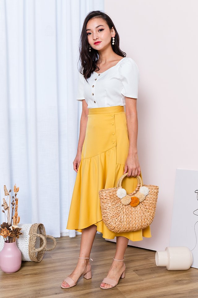 Ariel Asymmetrical Buttons Skirt in Mustard