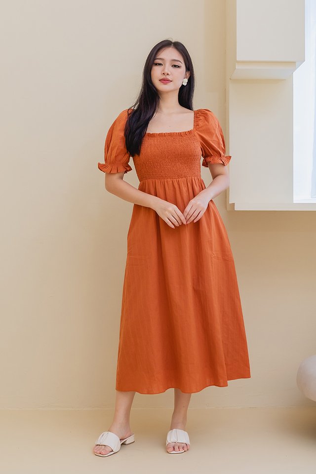 Ariana Cotton Smocked Dress in Rust